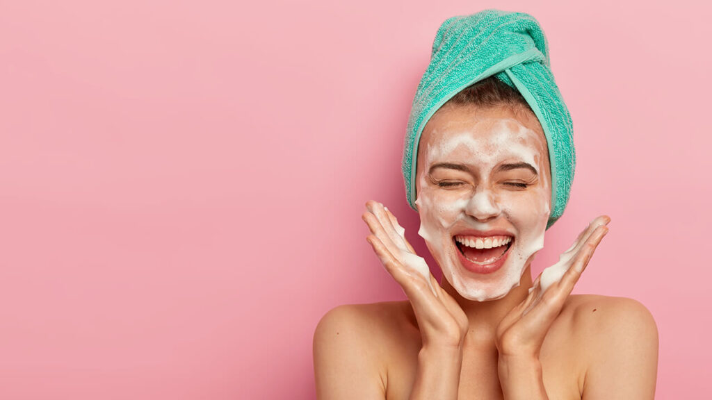 Cleaning face with facial cleanser